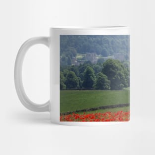 Field of poppys  near baslow in derbyshire with chatsworth house in the distance Mug